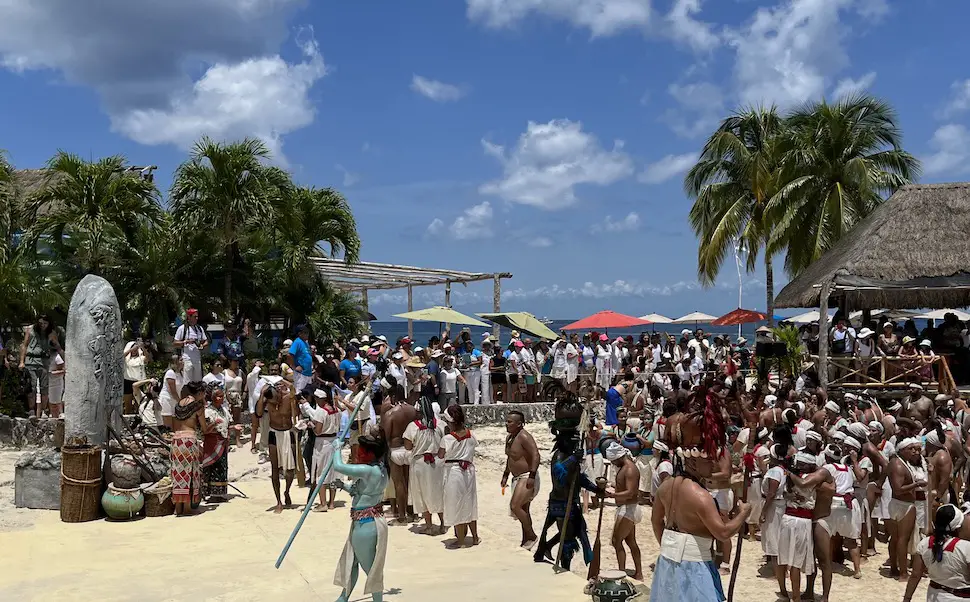Reenactors in Mayan Sacred Crossing garb greeted by local gods at altar on the Cozumel beach at Chankanaab Park 2023