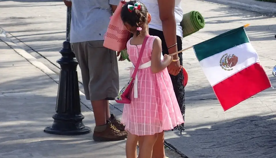 Young girl at Cozumel parade with MX flag