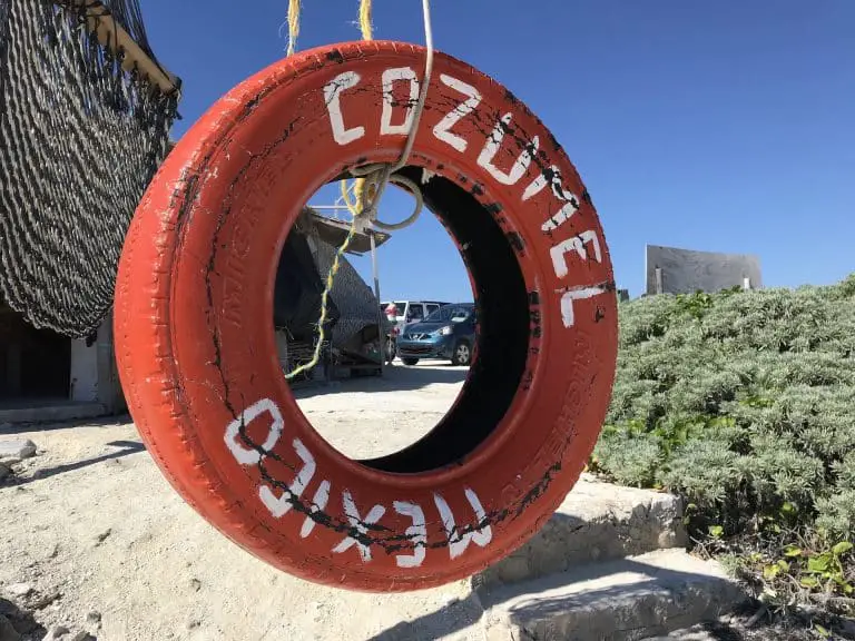Cozumel painted tire swing at beach