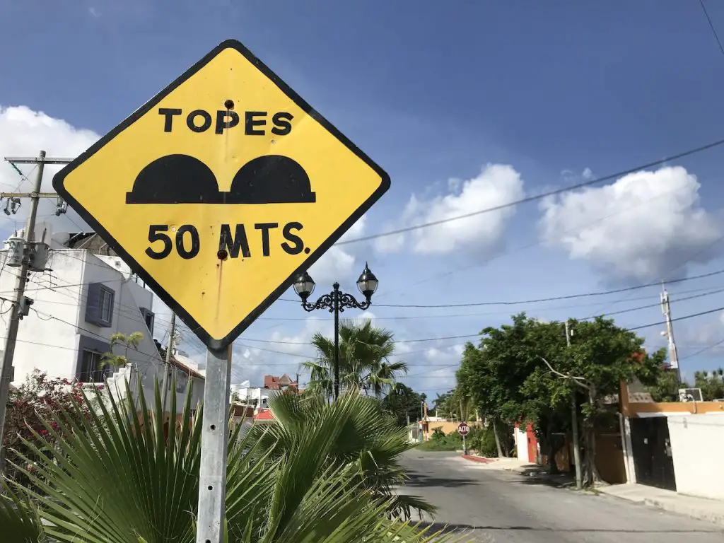 Speed bump warning sign on Cozumel MX side street