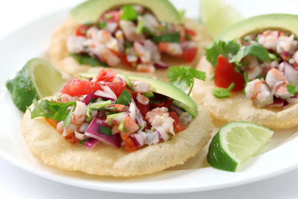 Small tortillas topped with fresh ceviche salad