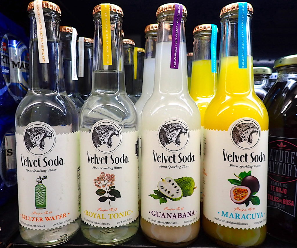 A selection of "Velvet Soda" brand artisanal sodas in Cozumel grocery store shelf. 