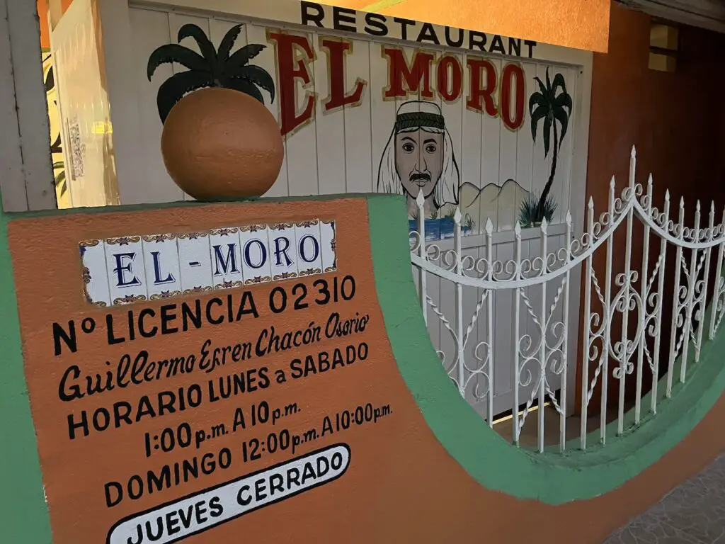 Author's photo of the entrance facade to El Moro restaurant, a longtime favorite local Mexican restaurant in a residential area of Cozumel. Photo in 2023. 