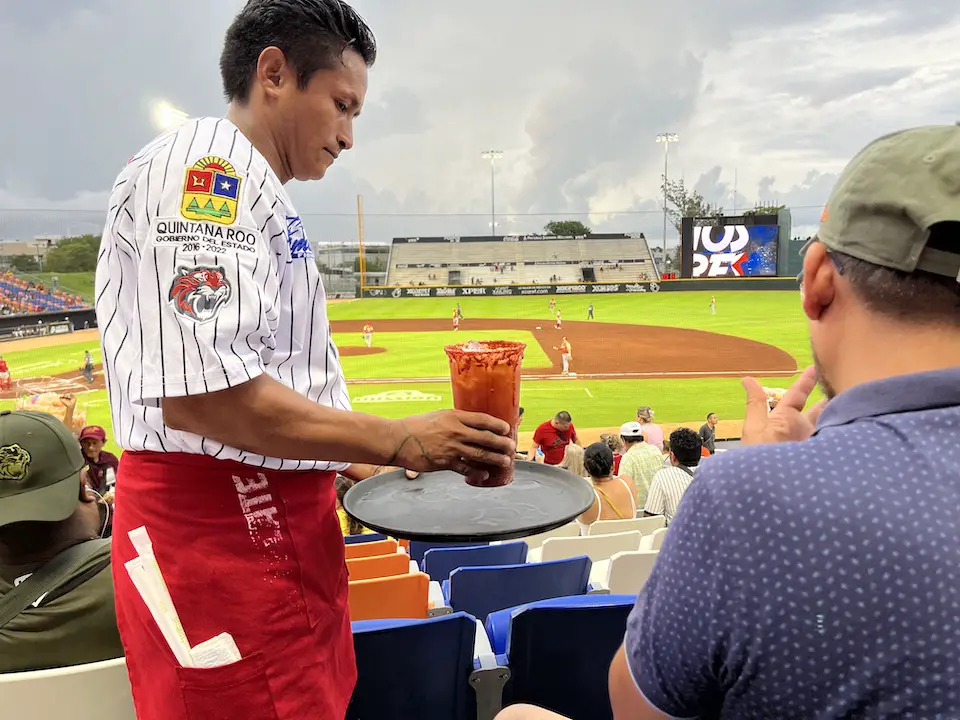 Image by author of a drinks vendor in the stands at the Cancun Tigres baseball stadium in 2023. 